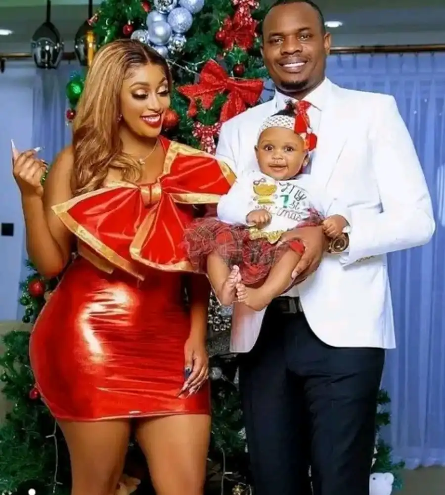 Amber Ray and her husband, Kennedy holding Africannah
